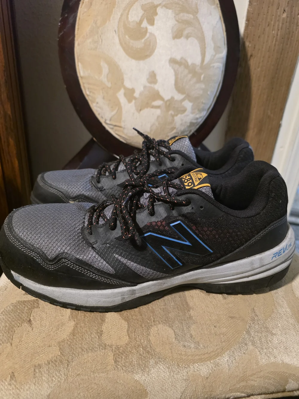 New Balance Gray and Black Men's Athletic Sneakers with Blue Accents